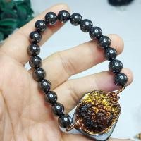 ราคา สร้อยข้อมือ อุลกมณีโปร่งแสง(สะเก็ดดาวไทย) และเม็ดหินเฮมาไทต์ (26884890900)