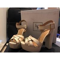 ราคา รองเท้าส้นสูง รัดส้น สีขาว ยี่ห้อ Lyn แท้ (1887369481)