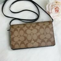 ราคา COACH FOLDOVER CROSSBODY CLUTCH IN SIGNATURE CANVAS (7814369298)