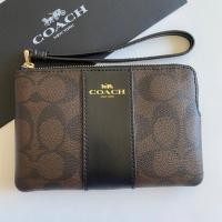 ราคา COACH CORNER ZIP WRISTLET IN SIGNATURE CANVAS #F58035 (4451450414)