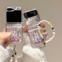 ราคา SAMSUNG LUKENเคสโทรศัพท์สําหรับSamsung Galaxy Z Flip 6 5 4 3 OPPOค้นหาN2 Flip N3 Flipแฟชั่นปราสาทดอกไม้ไฟปกหลังพร้อมสร้อยข้อมือสําหรับFlip3 Flip4 Flip5 Flip6 N2Flip N3Flip Z Flip 7 (42505759606)