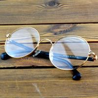 ราคา กรอบแว่นตาทรงกลม ผลิตจากไททาเนียมคุณภาพเยี่ยม มาพร้อมขอบสีทองและเลนส์สีดำ (56001000206)