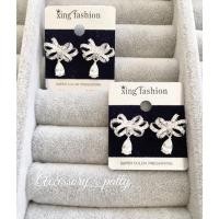 ราคา ต่างหูเพชร รุ่นCz86 ลายโครงโบว์มีตุ้งติ้งหยดน้ำค่ะ (77248094)