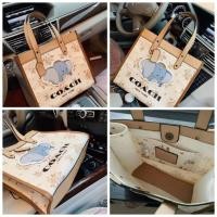 ราคา กระเป๋าทรงช้อปปิ้งโค้ชดัมโบ้ใบใหญ่ (7457089697)