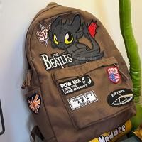 ราคา สาวเผ็ดเป็นเจ้าของสไตล์อเมริกันย้อนยุคก็อตซิลล่ามอนสเตอร์น้อยกระเป๋าเป้สะพายหลังผ้าม่านอินเทรนด์ฮิปฮอปกระเป๋านักเรียนสบายๆ1.13 (56904636075)