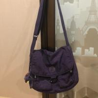 ราคา กระเป๋า kipling สะพายข้างมือสองสภาพดี สีม่วงไม่มีเฟดค่ะ พร้อมลิงสีม่วงน่ารักๆค่ะ (1412086667)