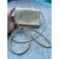 ราคา กระเป๋าสตางค์มีสายสะพายสีครีมมือสอง (43407127777)