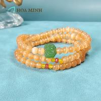 ราคา สร้อยข้อมือดีไซน์ด้วยสีส้ม-ชมพู หินตาแมว ขนาดลูกปัด 5.8 มม. แบบห่อด้วยชาร์มดอกบัวอาเกต 3 ตัว ล้อโมราตัดหน้า (41529123594)